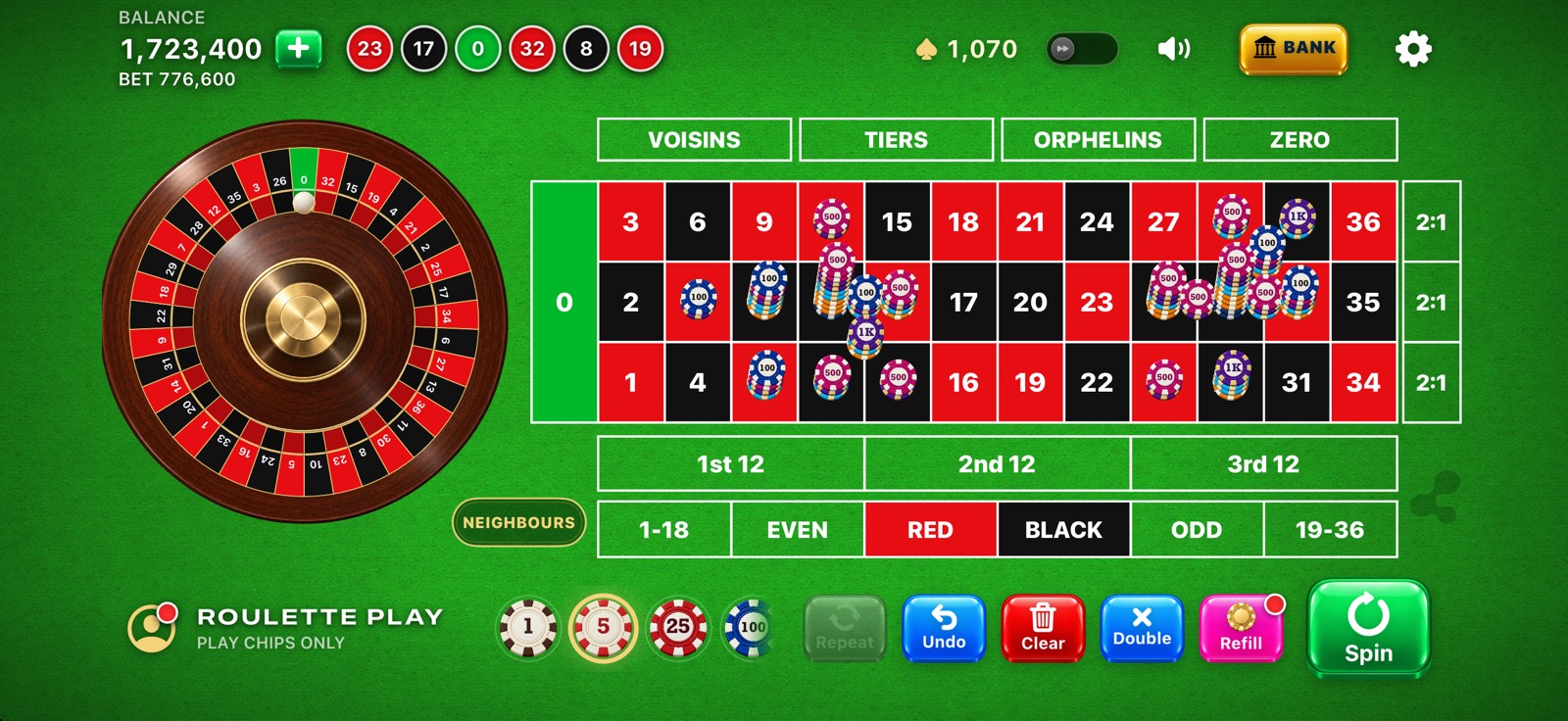 Roulette Play on iPhone in landscape, with the roulette wheel beside a European table and stacks of play chips on several numbers.